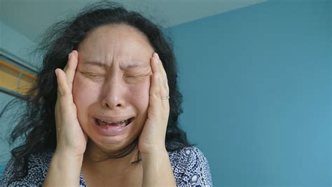 Upset Chinese Woman On A Textured Background Stock Footage Video