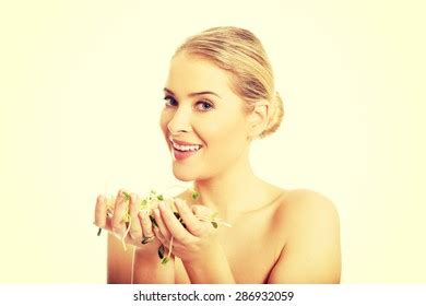 Healthy Nude Woman Holding Cuckooflower Stock Photo