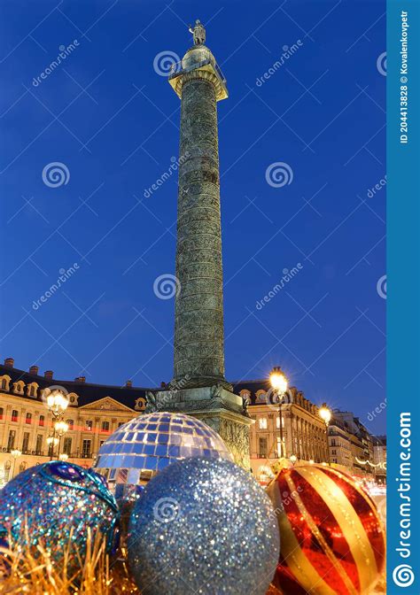 The Famous Vendome Column At Night With Christmas Baubles Paris