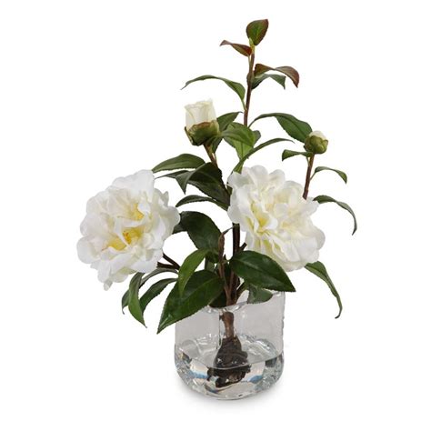 Realistic faux flowers in vase. Artificial Camellia flower cuttings with realistic flowers ...