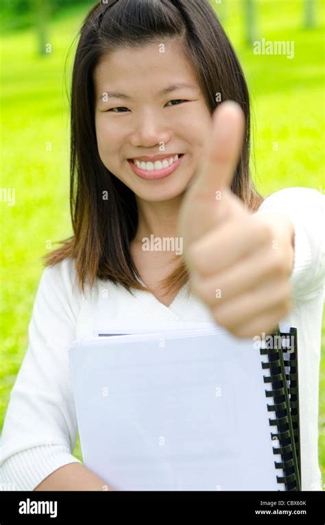 Female Student Thumbs Up With Great Smile Stock Photo Alamy