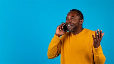 Premium Photo Emotional Black Man Having Phone Conversation Copy Space