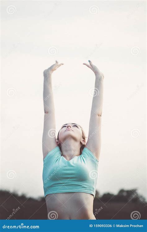 Young Woman Doing Breathing Exercises In Nature Taking A Deep Breath