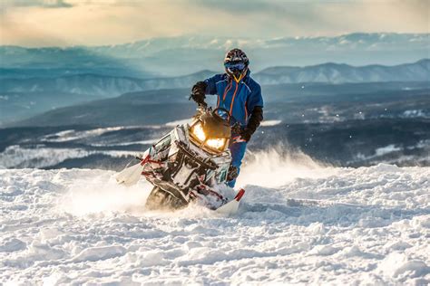 Rider On The Snowmobile In The Mountains Active Drive Outdoor Troop