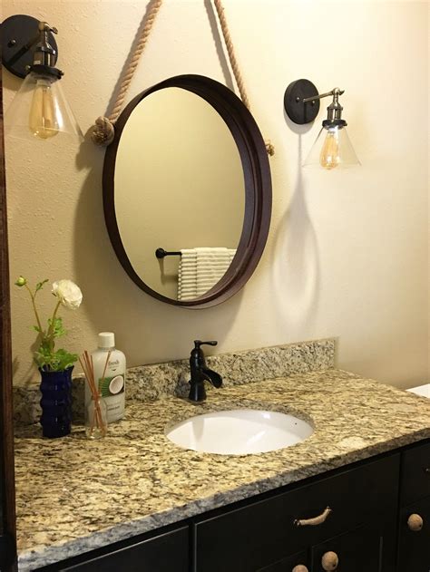 Unique Mirror And Sconce Combo To Customize This Bathroom Mirror And