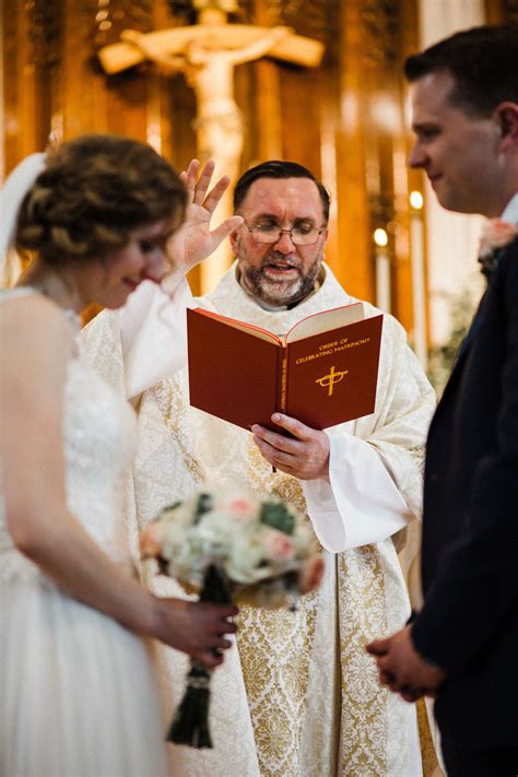 Priest Sings To Bride And Groom On Wedding Day