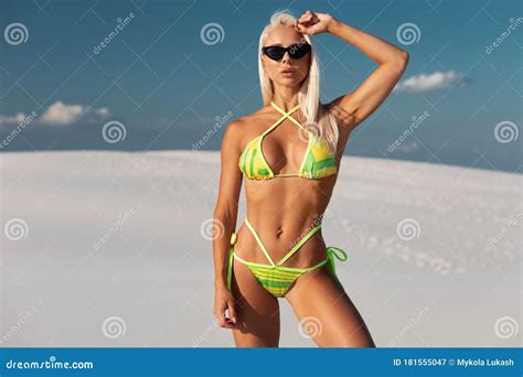 Beautiful Woman In Bikini Enjoying Summer Sun And Tanning During