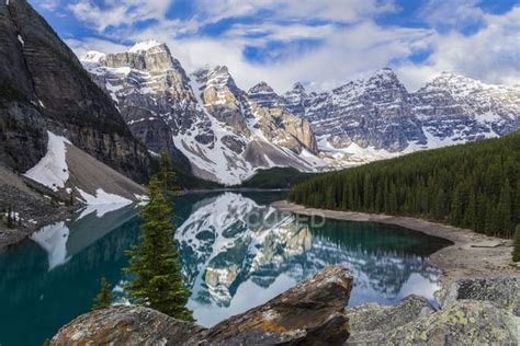 Rocky Mountains Reflecting In Moraine Lake In Banff National Park