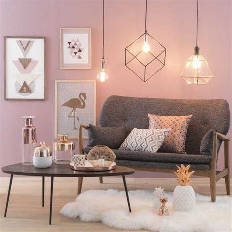 Gold accents and bright throw pillows warm up a charcoal sofa. Pink and Grey Living Room | Modern Decor | Geometric Lighting #homedecorlivingroommodern