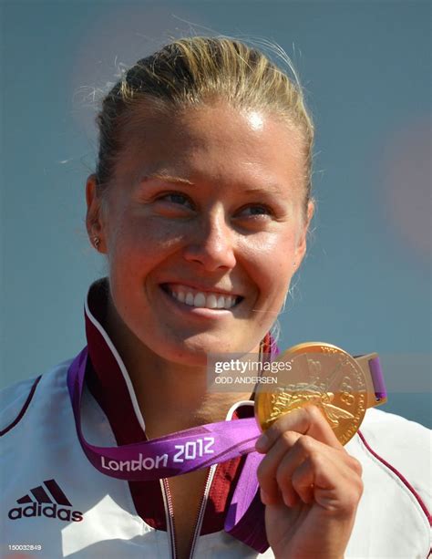 Hungarys Danuta Kozak Poses On The Podium With Her Gold Medal Won In