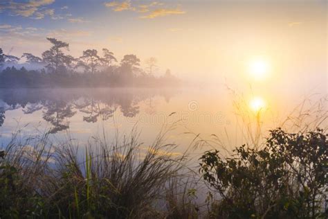 Rays Of Sunrise Over The Lake With Reflection Mist On The Water