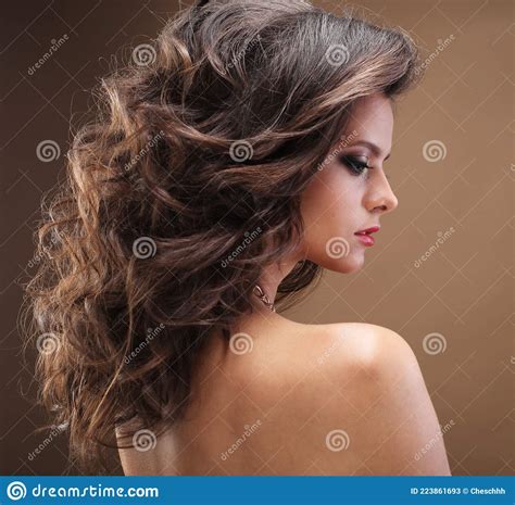 Brunette Girl With Long Healthy And Shiny Curly Hair Beautiful Model Woman With Wavy