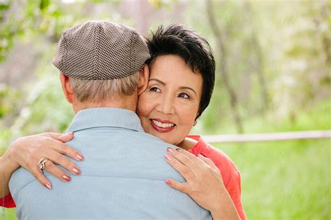Senior Asian Couple Hugging By Stocksy Contributor Curtis Kim Stocksy