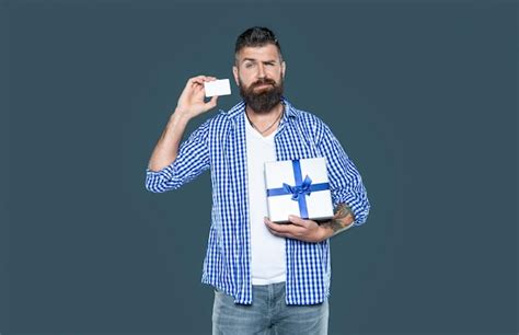 Premium Photo Mature Bearded Guy With Present Box And Card