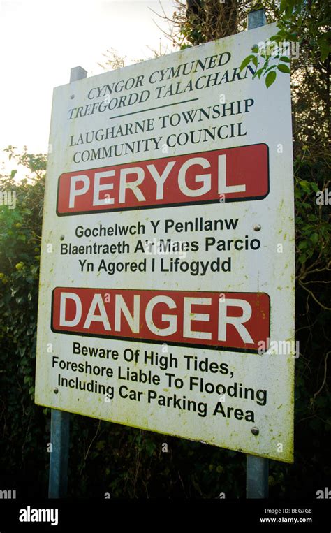 Laugharne Car Park Sign Danger Of Flooding In English And Welsh Stock