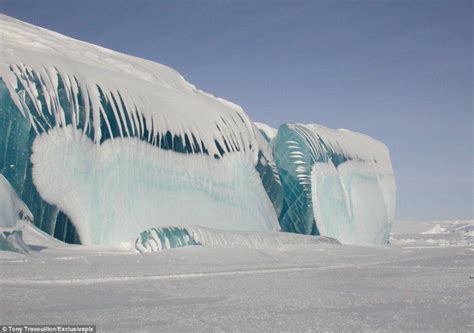 The Frozen Wave Stunning 50ft Blue Ice Monolith Captured In The