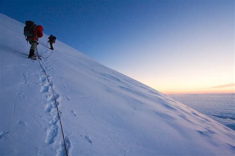 Mountain Climbers At Dawn On The Upper Slopes Of Mount
