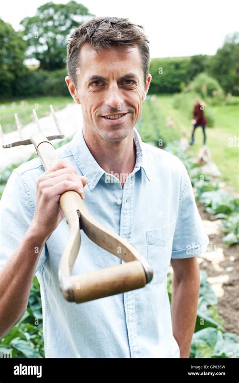 Portrait Of Farm Workers In Organic Field Stock Photo Alamy