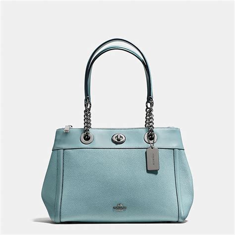 Shop The Coach Turnlock Edie Carryall In Polished Pebble Leather Enjoy