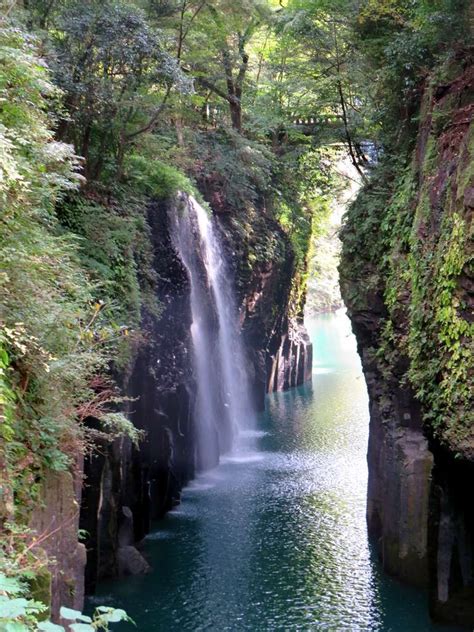 The Manai Waterfall Pours Over Basalt Cliffs In The Takachiho Gorge At