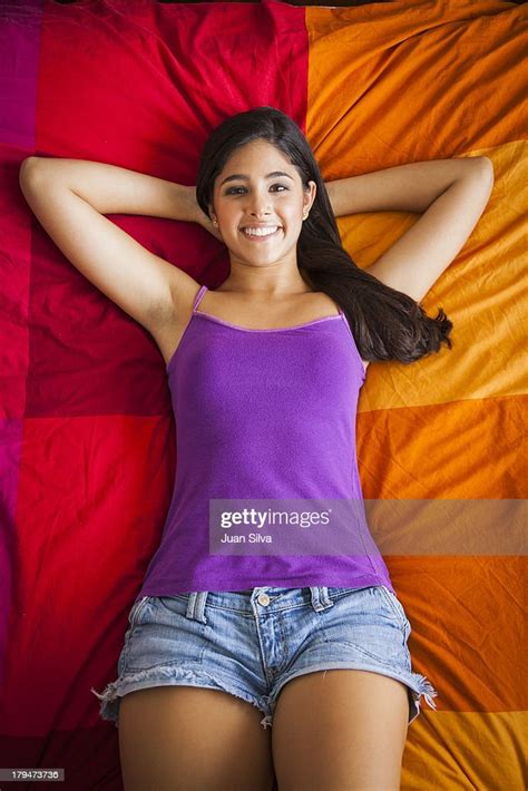 Teenage Girl Lying In Bed Smiling Bildbanksbilder Getty Images
