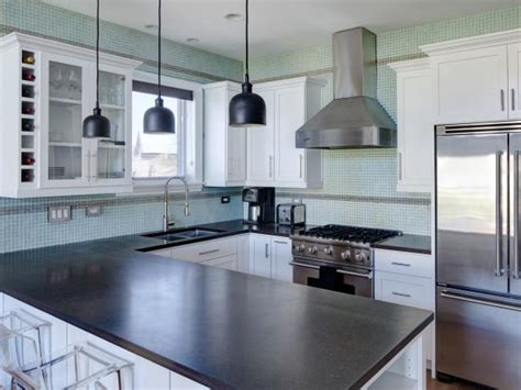 Contemporary Kitchen With Aqua Blue Tile Backsplash And White Cabinetry