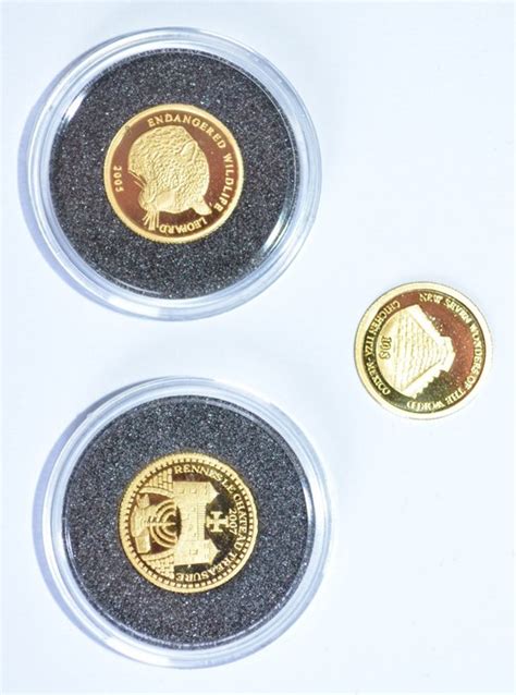 World 3 Small Gold Coins From Laos Salomon Islands And Benin 2005