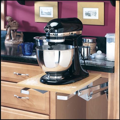Keep small appliances behind closed doors but still close at hand by designating a kitchen cabinet as a breakfast area or snack bar. We got this shelf for the trusty but heavy old Kitchen Aid ...