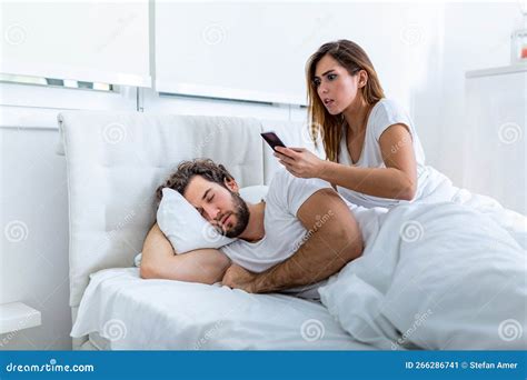 Jealous Wife Spying The Phone Of Her Partner While He Is Sleeping In A