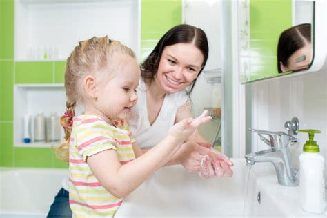 Happy Mother And Child Washing Hands With Soap In Stock Photo Image