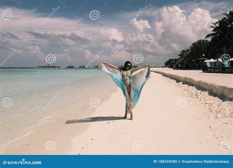 Woman In Elegant Beach Clothes Relaxing On Maldives Island Stock Image
