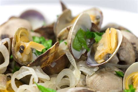 Sauté the onions and leeks in the olive oil… Recipe for Steamed Clams in White Wine - Life's Ambrosia Life's Ambrosia