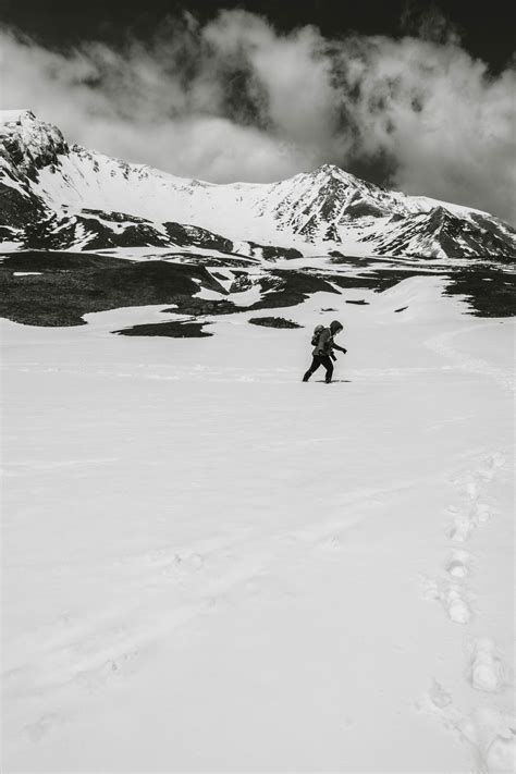 Man Standing On Snow Covered Mountain · Free Stock Photo