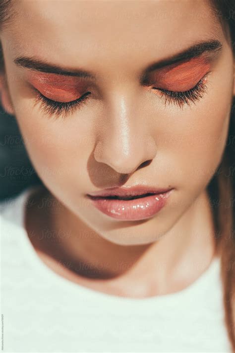 Sunlit Beauty Woman With Closed Eyes And Pink Eyeshadow By Stocksy Contributor Alexandra