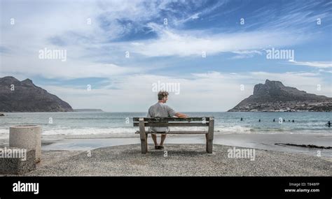 Mature Man Sitting Looking Out From Beach Bench Cape Town Western Cape South Africa Stock