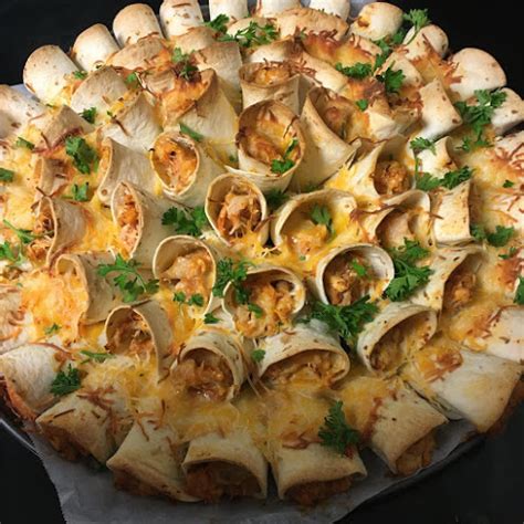 Roll the tortillas into cones, starting fro the cut edge and making sure not to push the ingredients out of the tortilla. Blooming Quesadilla Ring ! - FULL BUZZ