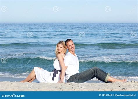 Smiling Couple Sitting On The Sand Stock Image Image Of Relaxation