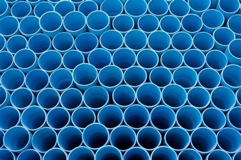 Premium Photo Blue Pvc Pipes For Water Stack In Warehouse