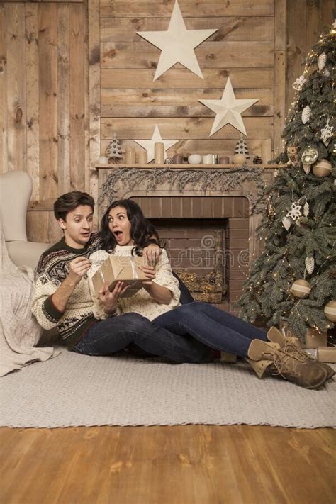 Beautiful Brunette Caucasian Romantic Loving Couple In Cozy Warm Sweaters In The Cabin On A