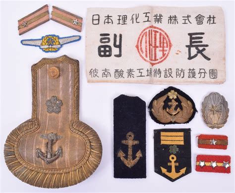 Selection Of WW2 Japanese Naval Badges And Insignia Consisting Of