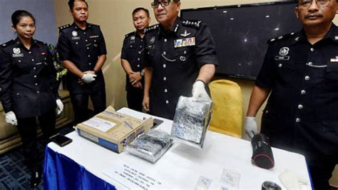 These white mini buses wait at the alleyway next to the shops in the saujana car park. Police seize drugs worth RM98,676 in Sibu, Kuching raids