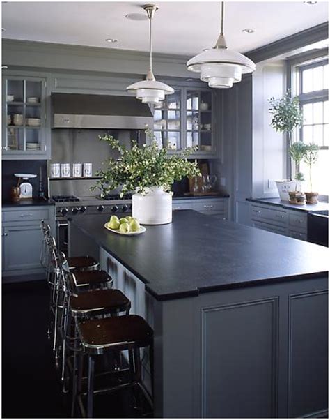 Dark counters—whether glossy or matte—will make your dishes shine and vibrant flowers and linens pop. Shades of Gray (With images) | Grey kitchen designs, Dark ...