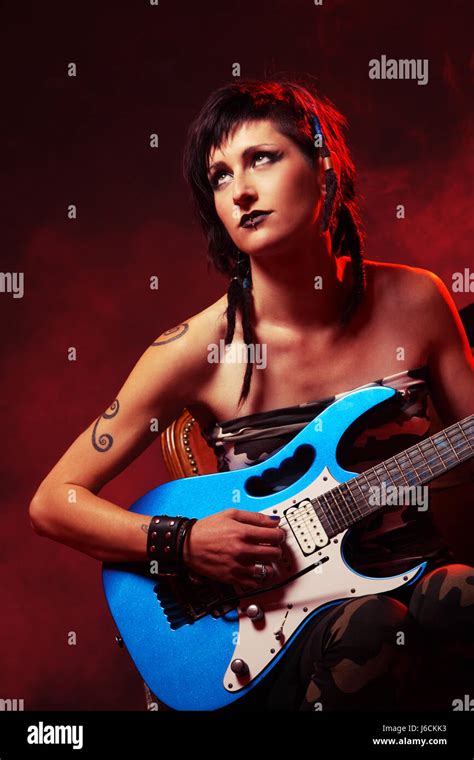 Female Guitarist Playing Guitar At A Rock Concert Stock Photo Alamy