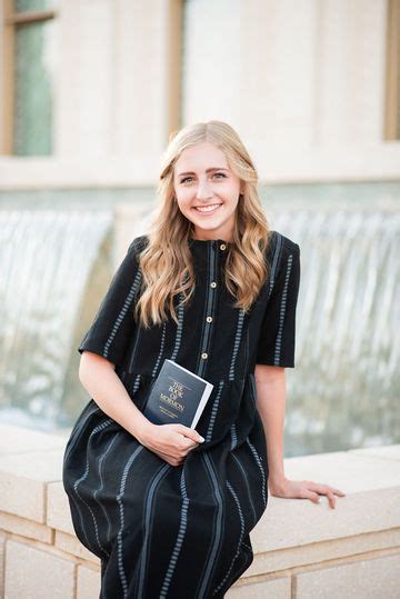 Lds Sister Missionary Photographed With Book Of Mormon At The Gilbert Arizon Sister