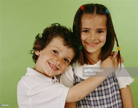 Boy Hugging Girl Portrait High Res Stock Photo Getty Images