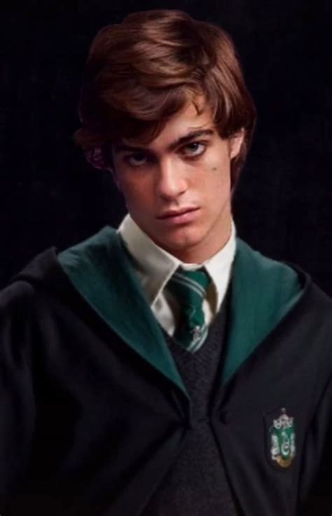 A Young Man Wearing A Green And Black Harry Potter Costume With His