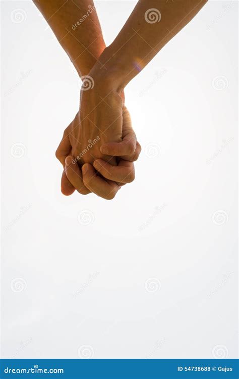 Couple With Clasped Hands In A Closeup Conceptual Image Of Love Stock