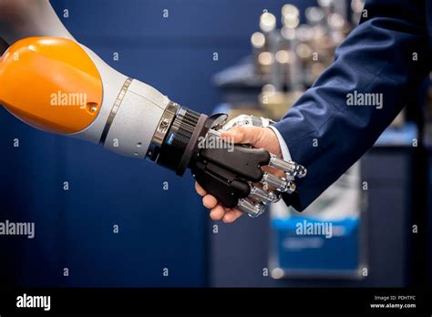 Robot Hand Shaking Human Hand Concept Picture Of Robot And Man