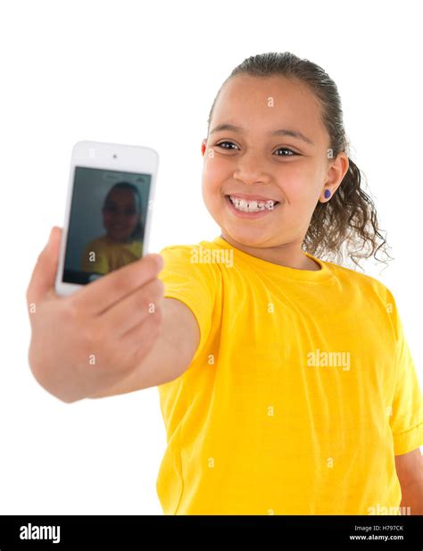 Young Girl Taking A Self Portrait With Phone Camera Isolated On White