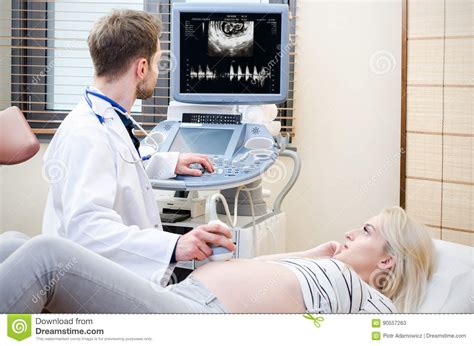 Pregnant Woman At The Doctor Ultrasound Diagnostic Machine Stock Image
